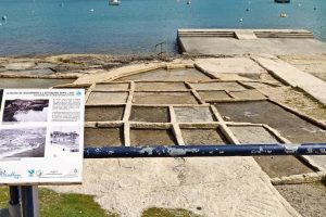 Salt pans and a touristic attraction plaque describing them