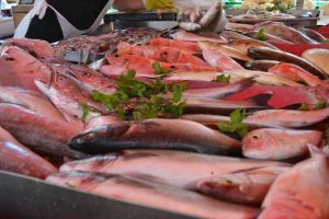 Fresh fish displayed on a stall at a farmer's market